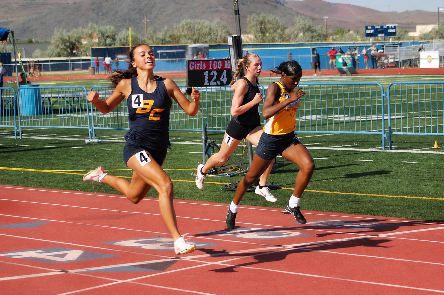 Sprinters battling to the line in the girls 100m